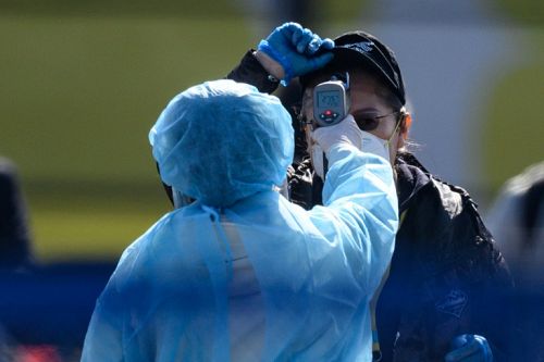 ภาพประกอบข่าว: ประเทศญี่ปุ่นเคยถูกวิพากษ์วิจารณ์อย่างหนักเรื่องการรับมือไวรัส COVID-19 / AFP
